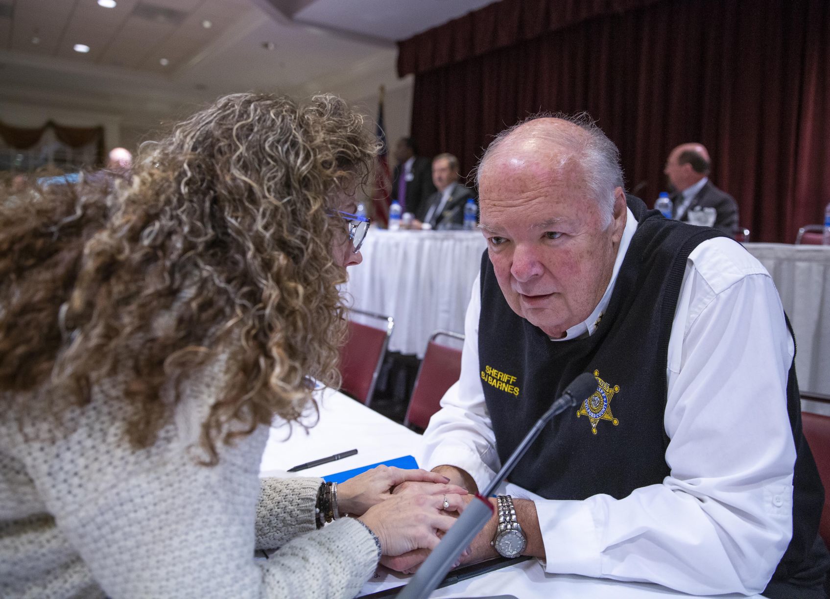 Sheriff BJ Barnes listens to parent at school safety hearing